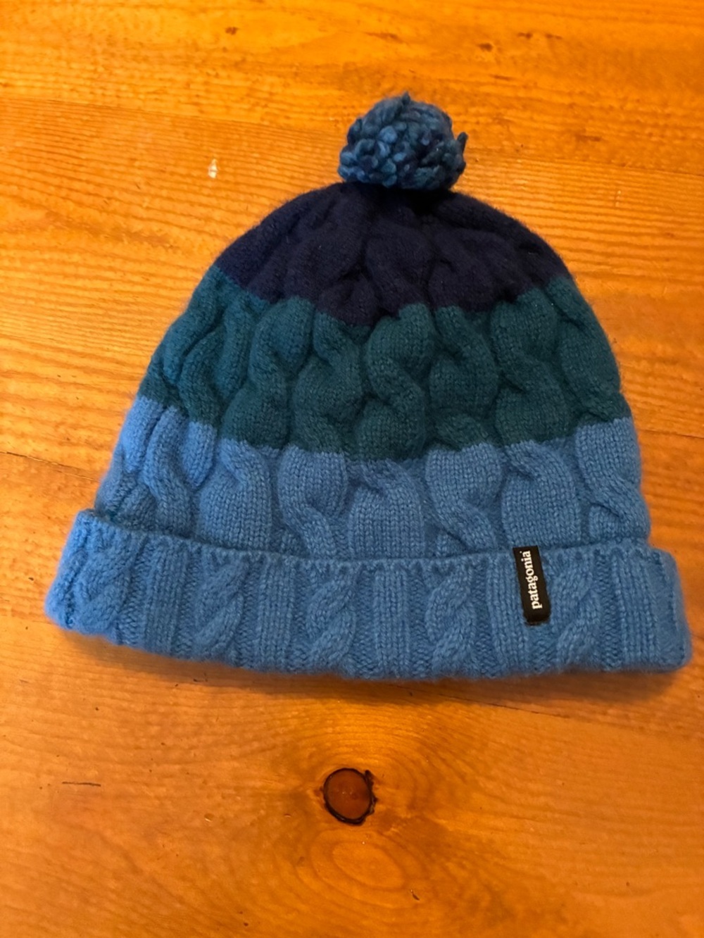 Patagonia women’s merino wool blend stripe pom beanie